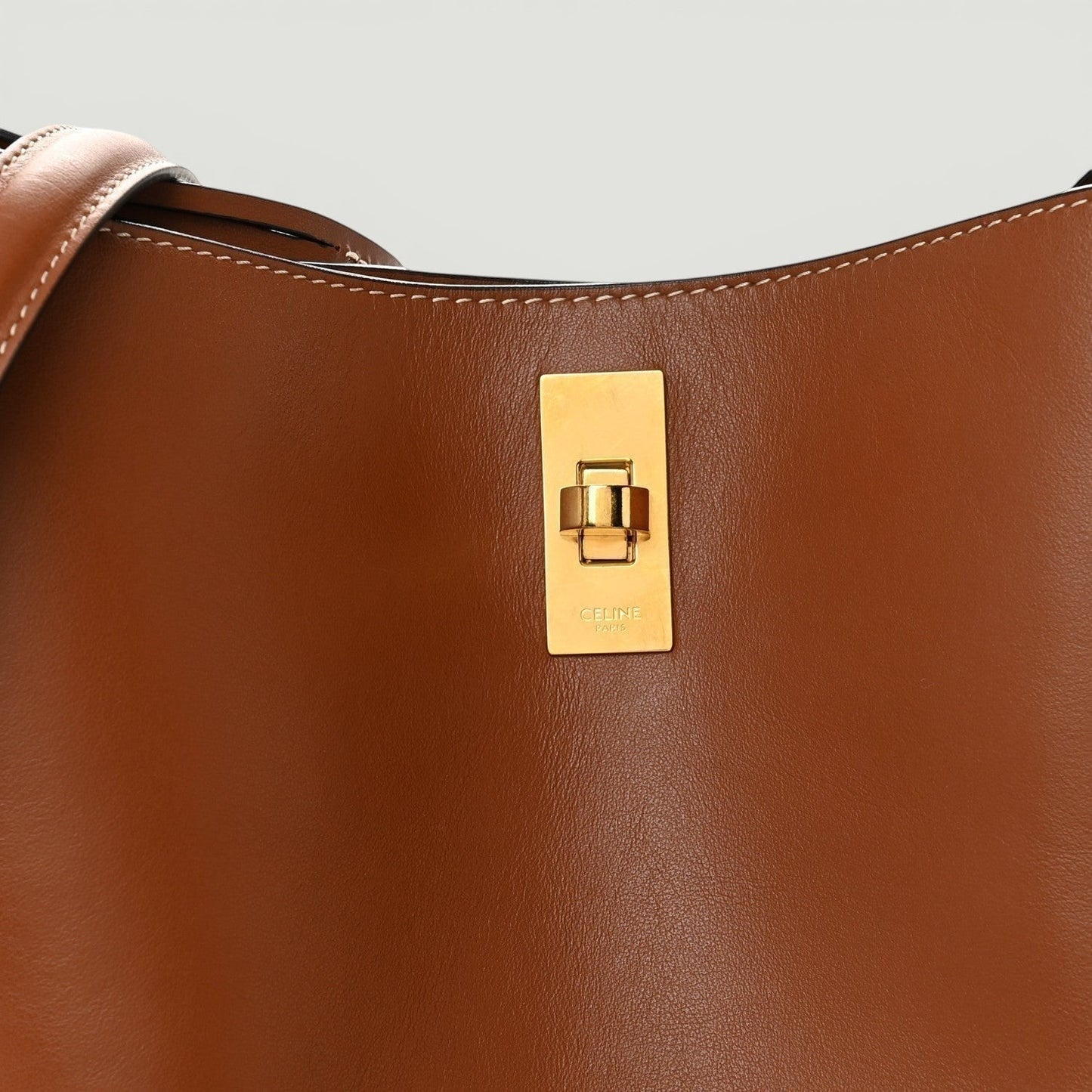La Volta CELINE tan smooth calfskin Bucket 16 bag with polished gold-tone hardware and signature turn-lock closure.