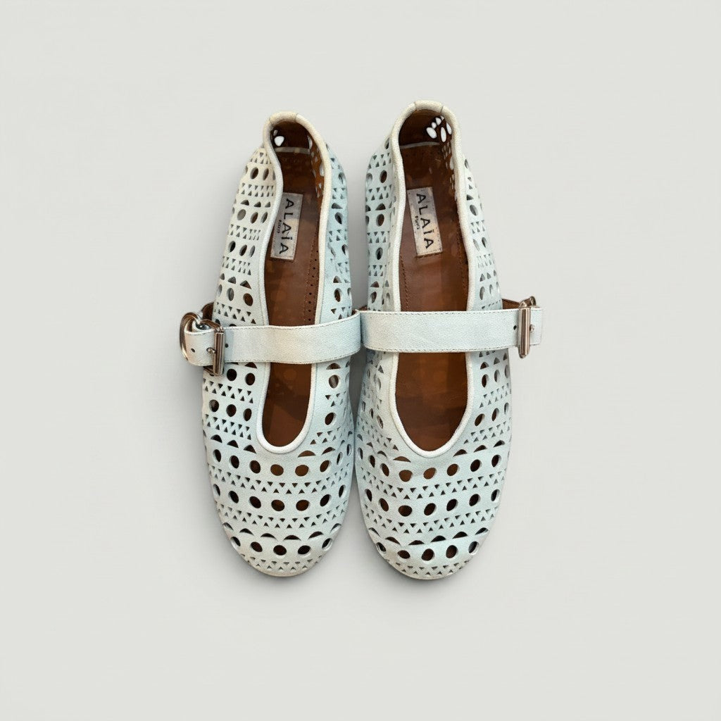 La Volta Alaïa light blue suede ballet flats with iconic Vienne laser-cut motif and buckle strap detail.