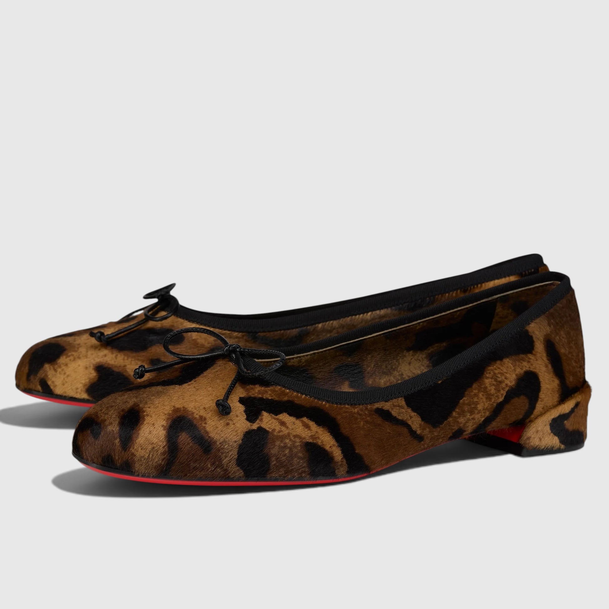 La Volta Christian Louboutin Sweetie Jane ballerinas in Bengali-printed pony hair with a black bow and red sole