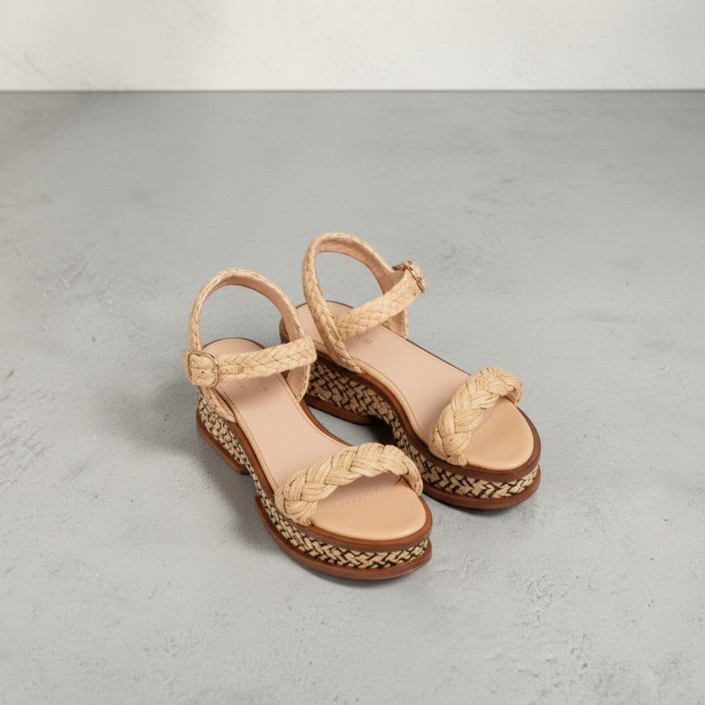 La Volta Gabriela Hearst braided raffia platform sandals with leather ankle buckle straps in beige.
