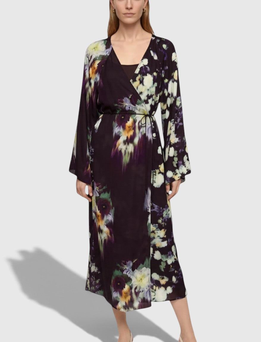 La Volta RODEBJER floral print maxi dress with a wrap silhouette and long sleeves worn by a model