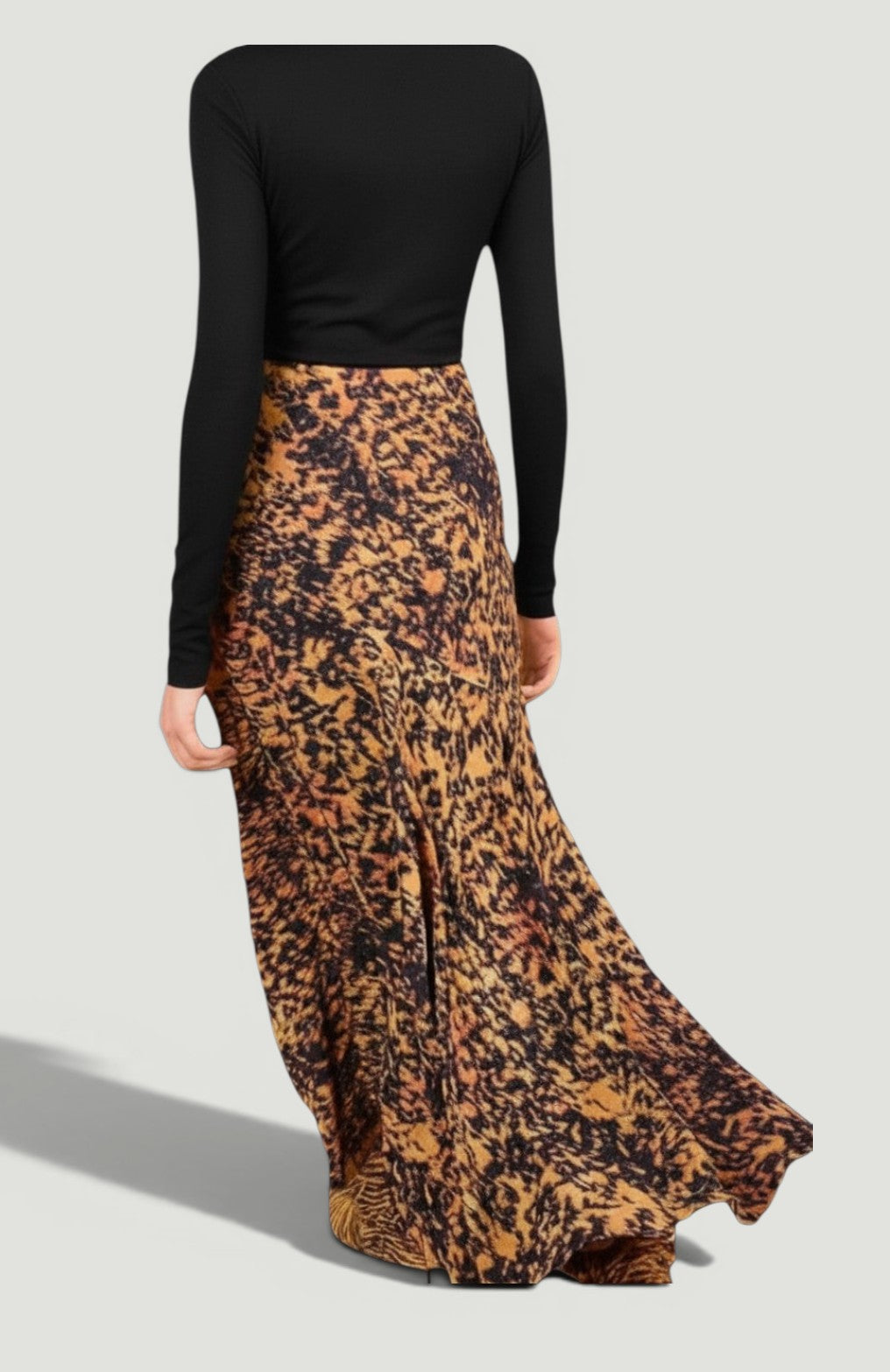 La Volta ULLA JOHNSON midi skirt in leopard ikat print satin-back crepe with a flared bias-cut hem, back view.