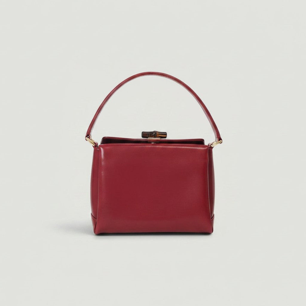 Vintage red calf leather Gucci top handle bag with bamboo twist lock closure, available at La Volta.